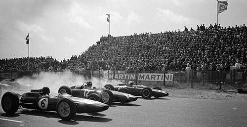 Start of the Dutch Grand Prix 1963: Smoking wheels in first row from later race winner Jim Clark (Lotus Climax 25, #6), Graham Hill (BRM P57, #12) and BrucPhoto © 2017 Rainer W. Schlegelmilch. All rights reservede McLaren (Cooper-Climax T66, #20)<br>